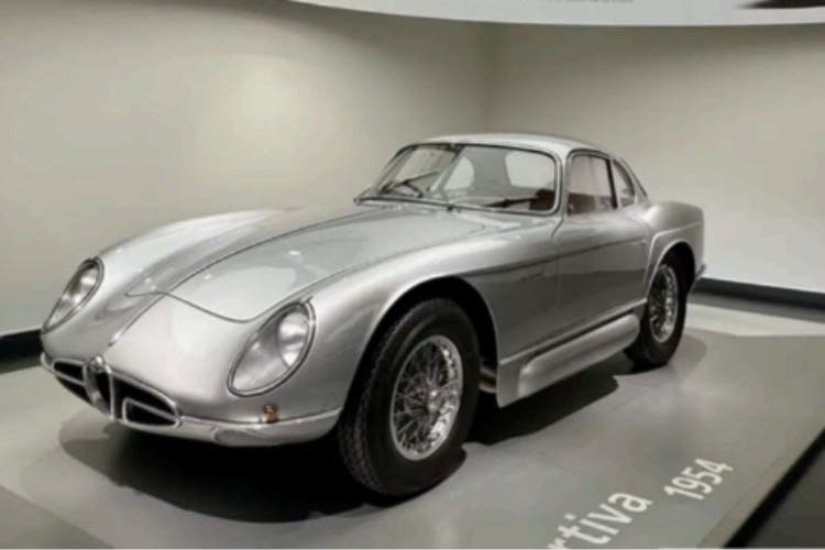 Classic vintage sports coupe displayed in showroom