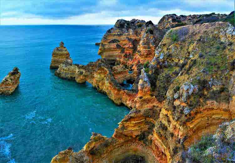 Mesmerizing view of Lagos beach in Portugal on a cloudy day