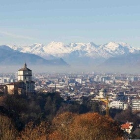 Cityscape of Turin with snowy Alps mountains