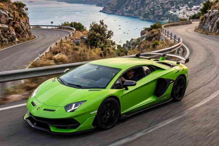 Lamborghini performance car on winding hillside road