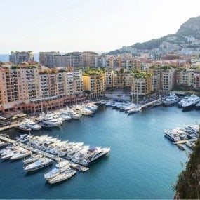 Coastal cityscape with skyscrapers and yacht marina, Monaco