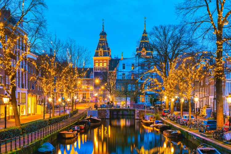 Amsterdam Netherlands canals with christmas lights during December, canal historical centre of